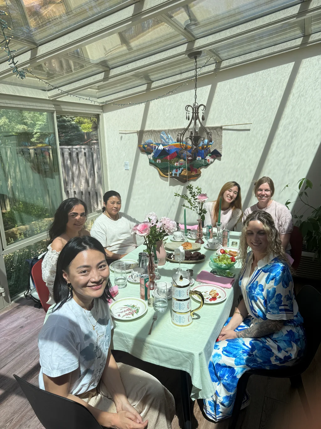 Friends sharing the curated table together