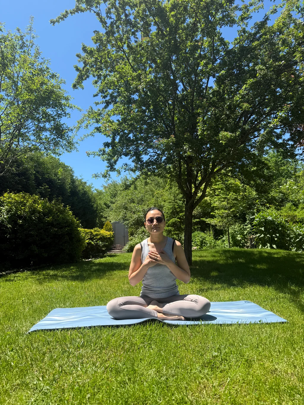 Meditation on a mat under the trees