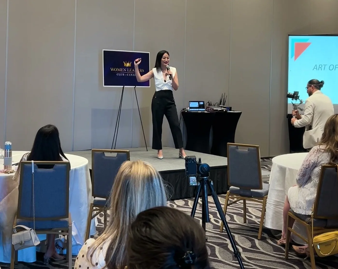 Nomin speaking about the Art of Receiving on stage at Women Leaders Club Canada